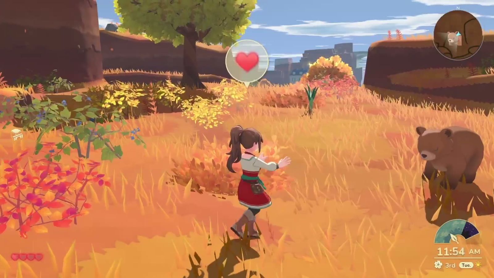 Official trailer frame: a bear roaming a field alongside the player
